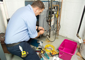 man repairing furnace